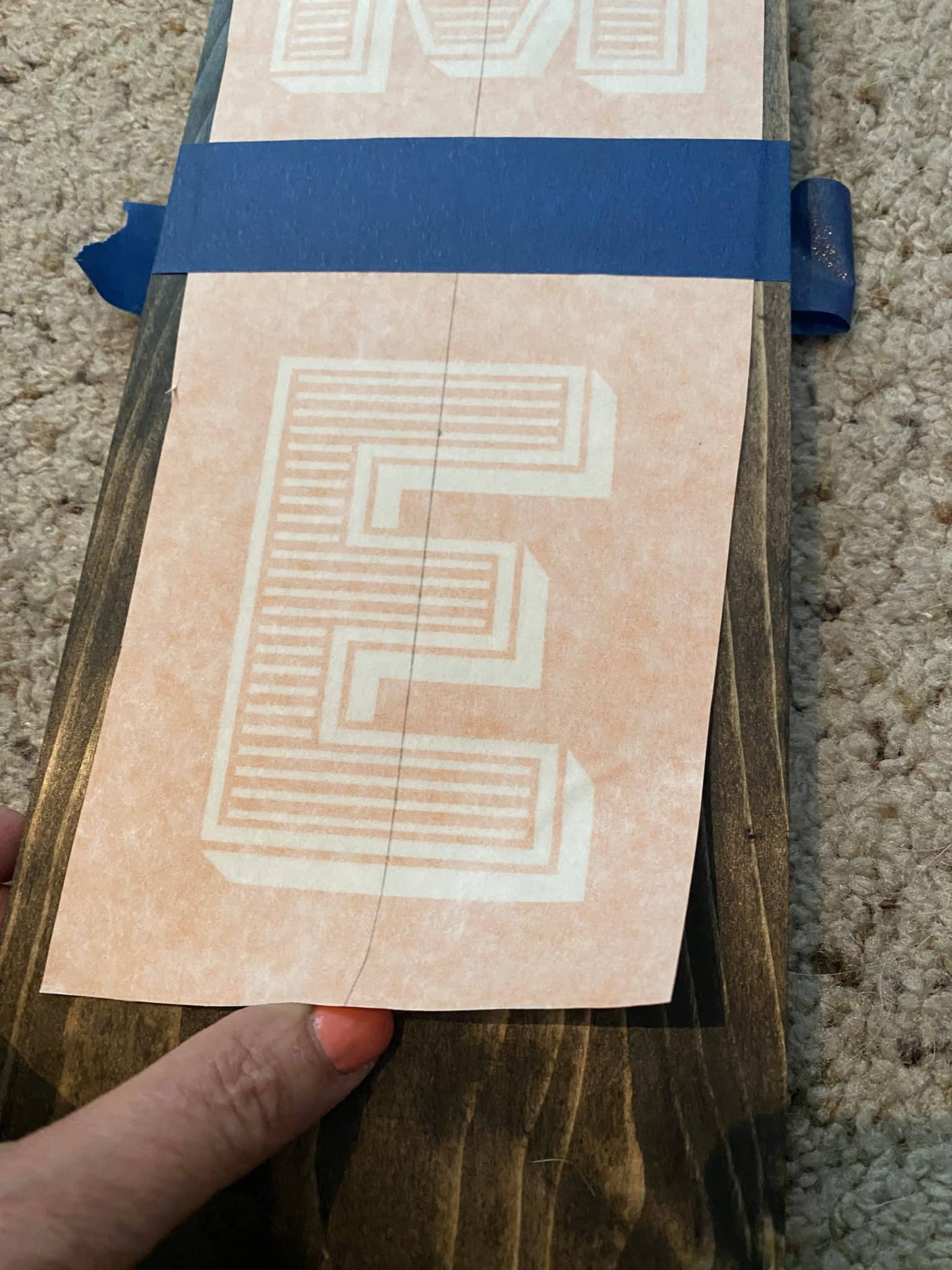 applying contact paper stencil to board with hinge method
