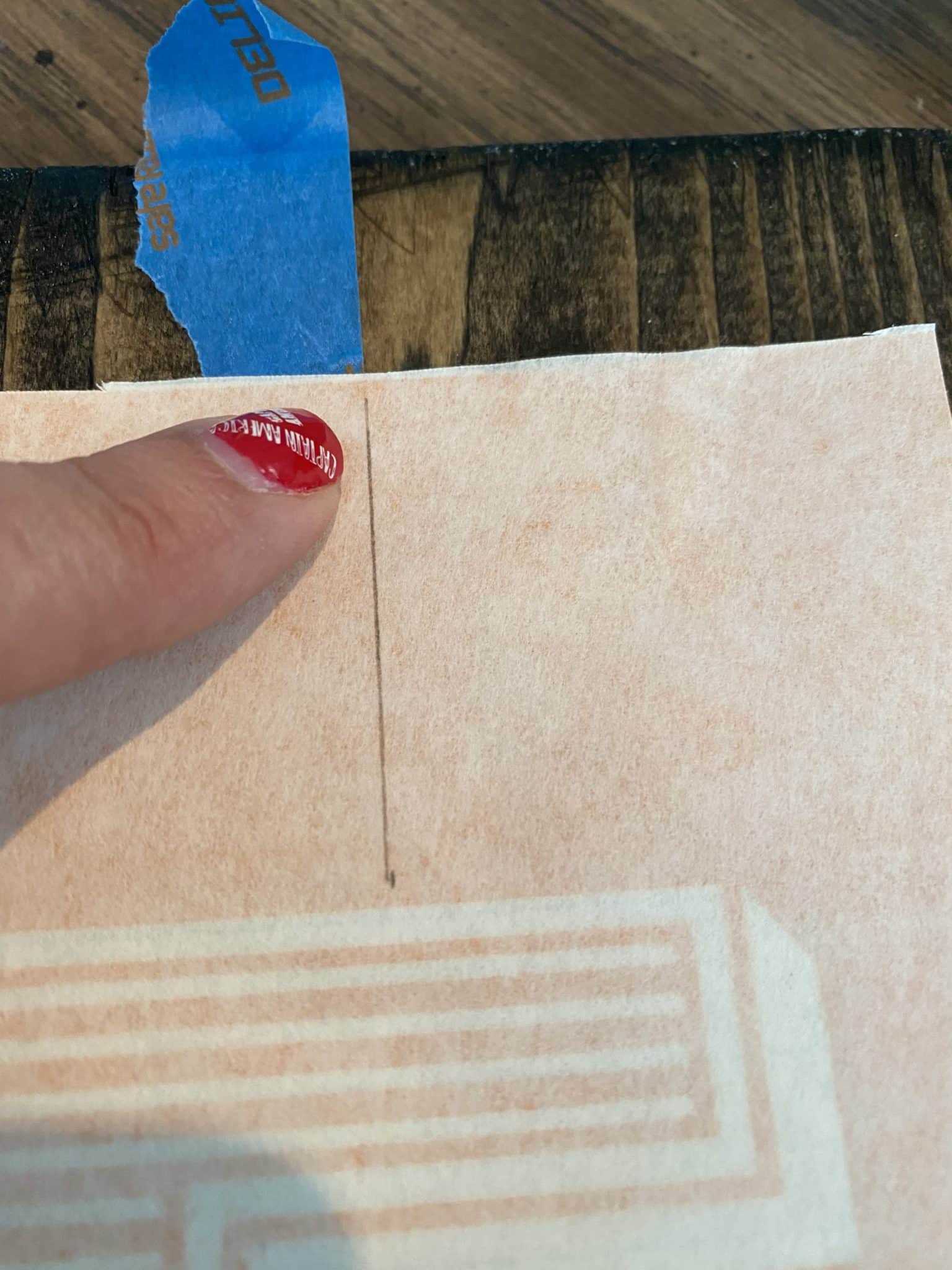align tape and center mark on contact paper stencil